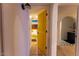 Bright hallway with access to bedroom and bathroom at 8520 W Palm Ln # 1049, Phoenix, AZ 85037