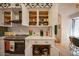 Bright kitchen with white cabinets and colorful dishware at 8520 W Palm Ln # 1049, Phoenix, AZ 85037