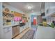 Modern kitchen with white cabinets, quartz countertops, and a farmhouse sink at 8520 W Palm Ln # 1049, Phoenix, AZ 85037