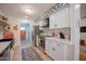 Modern kitchen with white cabinets and a geometric backsplash at 8520 W Palm Ln # 1049, Phoenix, AZ 85037