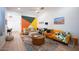 Spacious living area featuring a sectional sofa and large artwork at 8520 W Palm Ln # 1049, Phoenix, AZ 85037