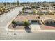 Aerial view of a single story home, nicely landscaped front yard, and street view at 10301 W Cheryl Dr, Sun City, AZ 85351