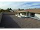 Large backyard with gravel landscaping and covered patio at 10301 W Cheryl Dr, Sun City, AZ 85351