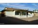 Large backyard with gravel and covered patio at 10301 W Cheryl Dr, Sun City, AZ 85351