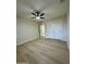 Light and airy bedroom with wood-look flooring and large closet at 10301 W Cheryl Dr, Sun City, AZ 85351