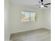 Spacious bedroom with wood-look floors and a ceiling fan at 10301 W Cheryl Dr, Sun City, AZ 85351