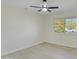 Simple bedroom with wood-look floors and a ceiling fan at 10301 W Cheryl Dr, Sun City, AZ 85351