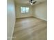 Spacious bedroom featuring light walls and wood-look floors at 10301 W Cheryl Dr, Sun City, AZ 85351