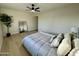 Spacious bedroom with large mirror and ceiling fan at 10301 W Cheryl Dr, Sun City, AZ 85351