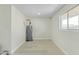 Laundry area with new flooring and a water heater at 10301 W Cheryl Dr, Sun City, AZ 85351