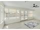 Bright living room featuring light wood floors and a view to the backyard at 10301 W Cheryl Dr, Sun City, AZ 85351