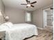 Spacious bedroom with ceiling fan, and ensuite bathroom access at 10317 E Tillman Ave, Mesa, AZ 85212