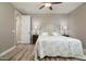 Bright bedroom with ceiling fan and wood flooring at 10317 E Tillman Ave, Mesa, AZ 85212