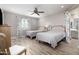 Bedroom with two twin beds, ceiling fan, and ensuite bathroom at 10317 E Tillman Ave, Mesa, AZ 85212