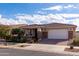 Beautiful one-story home with a two-car garage and well-maintained landscaping at 10317 E Tillman Ave, Mesa, AZ 85212