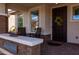 Inviting front porch with brickwork and wicker furniture at 10317 E Tillman Ave, Mesa, AZ 85212