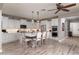 Bright kitchen with island, double oven, and white cabinets at 10317 E Tillman Ave, Mesa, AZ 85212