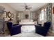 Cozy living room featuring a beige sofa and blue armchairs at 10317 E Tillman Ave, Mesa, AZ 85212