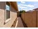 Landscaped side yard with a paved walkway at 10317 E Tillman Ave, Mesa, AZ 85212