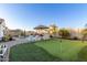 Spacious backyard with putting green, pool, and patio at 10496 W Cottontail Ln, Peoria, AZ 85383