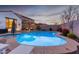 Enjoy this beautiful pool and spa at sunset at 10496 W Cottontail Ln, Peoria, AZ 85383