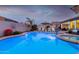 Enjoy this large kidney shaped pool at sunset at 10496 W Cottontail Ln, Peoria, AZ 85383