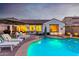 Large kidney shaped pool with spa and plenty of seating at 10496 W Cottontail Ln, Peoria, AZ 85383