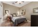 Cozy bedroom with a queen-size bed and neutral decor at 10496 W Cottontail Ln, Peoria, AZ 85383