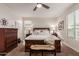 Comfortable bedroom with a queen-size bed and ample closet space at 10496 W Cottontail Ln, Peoria, AZ 85383