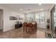 Cozy dining area with table and chairs near the back door at 10496 W Cottontail Ln, Peoria, AZ 85383