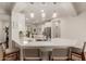 Modern kitchen with white cabinets and an island at 10496 W Cottontail Ln, Peoria, AZ 85383