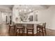 Modern kitchen with white cabinets and an island at 10496 W Cottontail Ln, Peoria, AZ 85383