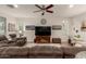 Bright living room featuring a large TV and comfy seating at 10496 W Cottontail Ln, Peoria, AZ 85383