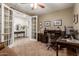 Home office with built-in desk and French doors at 10496 W Cottontail Ln, Peoria, AZ 85383