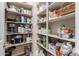 Well-stocked pantry with ample shelving for storage at 10496 W Cottontail Ln, Peoria, AZ 85383