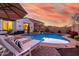 Luxury pool and spa with lounge chairs at 10496 W Cottontail Ln, Peoria, AZ 85383