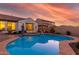 Stunning pool and spa area with sunset reflection at 10496 W Cottontail Ln, Peoria, AZ 85383