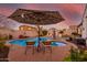 Inviting pool with lounge chairs and umbrella at 10496 W Cottontail Ln, Peoria, AZ 85383