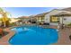 Stunning kidney-shaped pool with a built-in spa at 10496 W Cottontail Ln, Peoria, AZ 85383