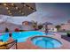 Relaxing pool and spa area with a covered patio at 10496 W Cottontail Ln, Peoria, AZ 85383