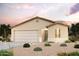 Single-story home with a 2-car garage and desert landscaping at 11004 W Torren Dr, Arizona City, AZ 85123