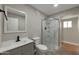 Modern bathroom with a walk in shower and gray vanity at 11411 E Crescent Ave, Mesa, AZ 85208