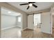 Spacious bedroom with an ensuite bathroom and barn door at 11411 E Crescent Ave, Mesa, AZ 85208