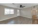 Bright and airy living room with wood-look tile flooring at 11411 E Crescent Ave, Mesa, AZ 85208