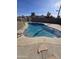 Inviting kidney-shaped pool with a concrete deck at 11411 E Crescent Ave, Mesa, AZ 85208