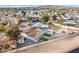 Aerial view of a remodeled house with a large backyard, artificial turf, and a fire pit at 1152 W Greenway Dr, Tempe, AZ 85282