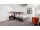 Spacious bedroom with a king-size bed and a seating area at 1152 W Greenway Dr, Tempe, AZ 85282