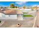 Remodeled home boasts a large backyard with artificial turf and fire pit at 1152 W Greenway Dr, Tempe, AZ 85282