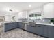 Modern kitchen with stainless steel sink and blue cabinets at 1152 W Greenway Dr, Tempe, AZ 85282