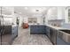 Modern kitchen with stainless steel appliances and gray cabinetry at 1152 W Greenway Dr, Tempe, AZ 85282